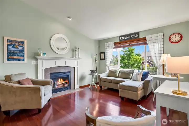 Vaulted living room with gas fireplace.