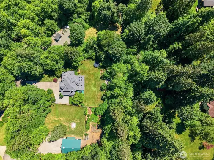 Rare opportunity to enjoy close-in country living on a stunning, 2.46-acre parcel surrounded by mature trees and natural beauty. The expansive grounds offer exceptional privacy, wide-open lawn areas for recreation, gardening, and entertaining, plus a versatile barn/shop for hobbies, storage, animals, or future possibilities. Thoughtfully positioned within a peaceful park-like setting, this property provides the perfect balance of space and seclusion while remaining just minutes from shopping, dining, major employers, and top-rated schools. A truly unique lifestyle property offering room to roam without sacrificing convenience. Rare opportunity to enjoy close-in country living on a stunning, 2.46-acre parcel surrounded by mature trees and natural beauty. The expansive grounds offer exceptional privacy, wide-open lawn areas for recreation, gardening, and entertaining, plus a versatile barn/shop for hobbies, storage, animals, or future possibilities. Thoughtfully positioned within a peaceful park-like setting, this property provides the perfect balance of space and seclusion while remaining just minutes from shopping, dining, major employers, and top-rated schools. A truly unique lifestyle property offering room to roam without sacrificing convenience.