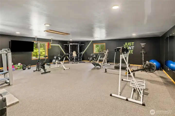 Flex space above garage currently a workout / weight room