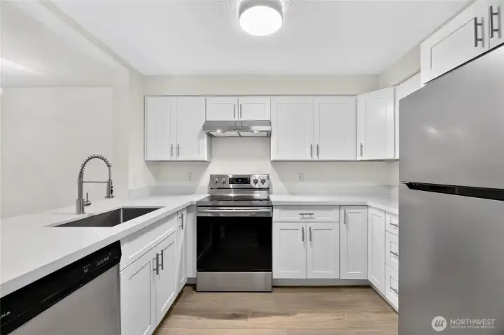 Completely remodeled kitchen with new cabinets, Quartz counters and designer fixtures.