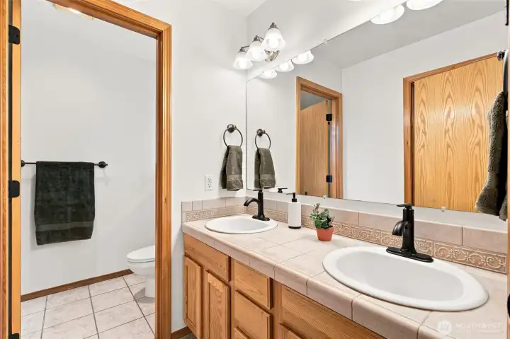 Primary bathroom suite with double sinks Primary bathroom suite with double sinks