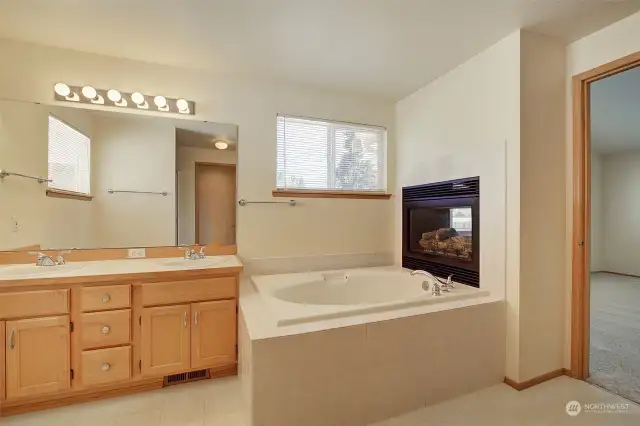 Soaking tub and cozy fireplace