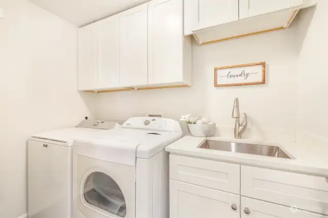 The laundry room is conveniently located on the second floor near the bedrooms.