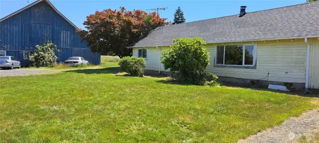 Front yard of Rambler. Also showing front of "Barn" and part of #3 Rental.