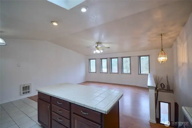 Kitchen island provides seating as well as dining nook