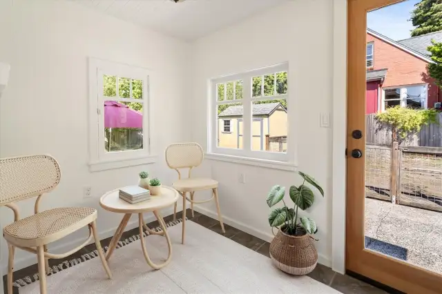 Come in the back door, into this charming enclosed back porch to the kitchen.