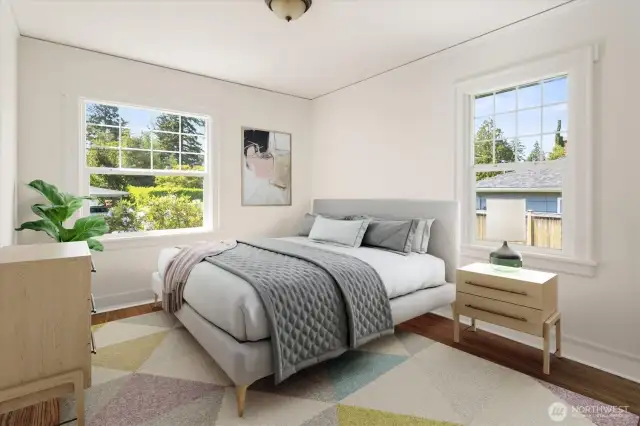 Primary bedroom on main floor, also with refinished hardwoods.
