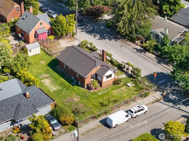 The lawn has been re-seeded is quickly filling in.  The freestanding storage shed is in good condition and stays.  This lot is by far one of the largest lots in this area, it's 8250 sq feet!
