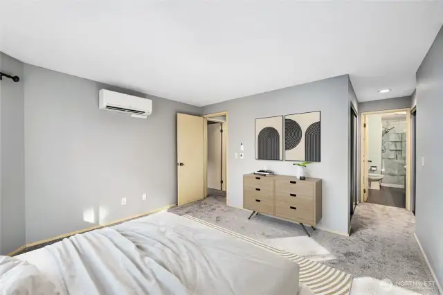 Primary Suite   Large space with view windows  Mitsubishi mini split for heat and A/C installed March 2024  Dual closets with mirrored doors.  Virtually Staged