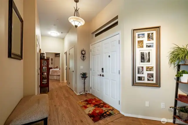 Entry hall way, coat closet on the left, storage/electrical panel and whole house water shutoff on the right. Second bedroom and bath at end of hall.