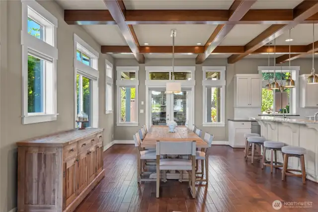 Flowing hardwoods and large windows allow the outside in
