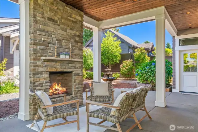 Entertain under a covered outdoor patio with gas fireplace and speakers