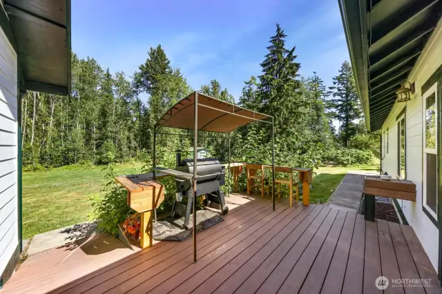 The large deck runs the back of the home and has space for a BBQ or smoker