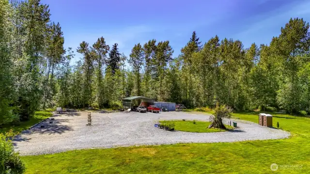 This large, flat parking area is a popular spot for RVs, Sprinter  Vans, and other campers. Outdoor toilets and washing station conveys
