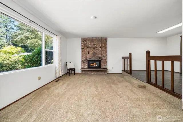 Main Floor Living room with fireplace and picture window