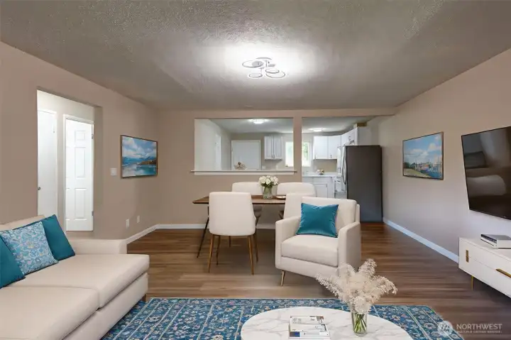 Livingroom looking towards the kitchen.  All new vinyl plank flooring