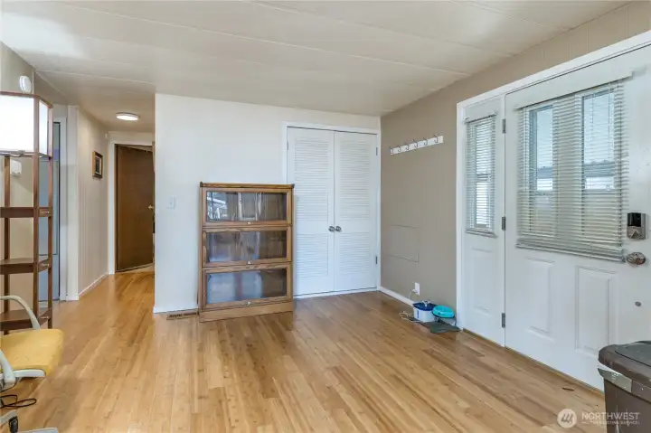 Warm bamboo flooring throughout the entry, kitchen and hall