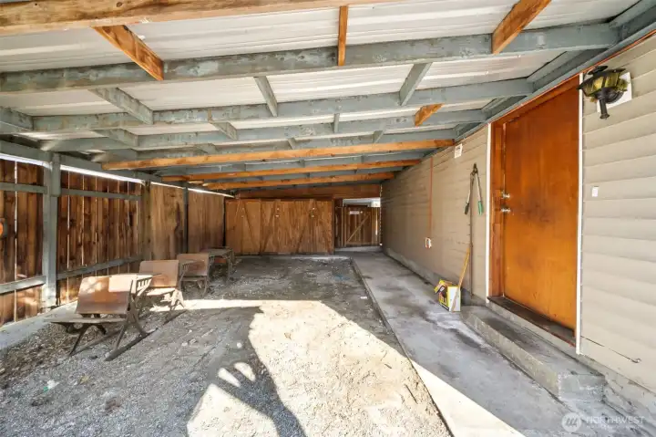 Carport on left side of house. Door on right is into the utility room. Gate in back, accesses the backyard.