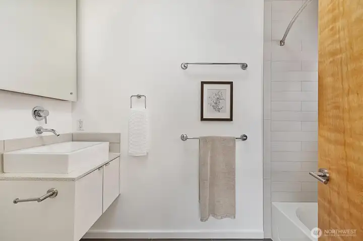 Primary bathroom with floating vanity, and a large soaking tub!