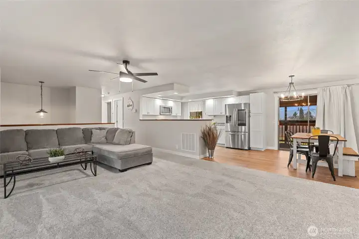 Living, dining, kitchen. Access to backyard -- deck