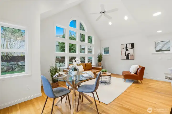 Vaulted great room benefits from ceiling fan that helps to keep the house warm or cool, depending on the season.