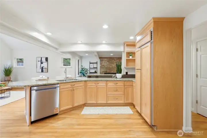 Wood paneled refrigerator offers generous storage for perishables, and new stainless dishwasher will make cleanup a breeze!