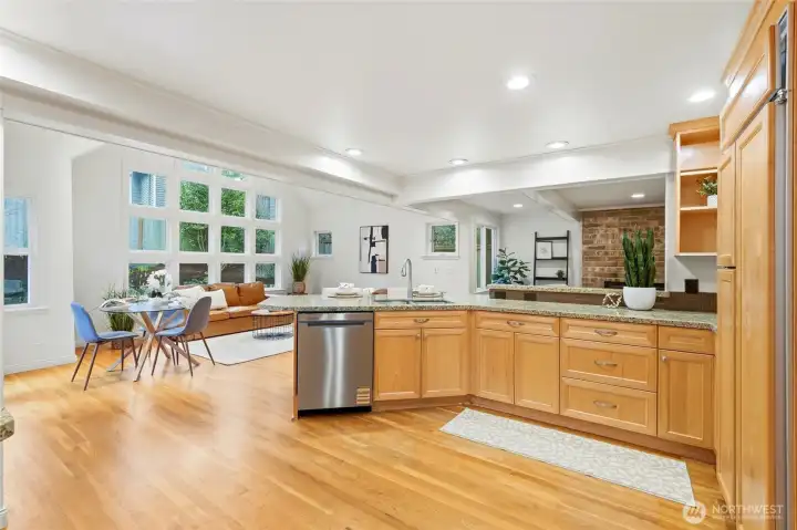 enerously sized kitchen enjoys the connection with great room and real hardwood floors that connect the two spaces.