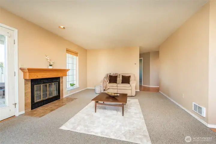 Spacious living room with wood burning fireplace