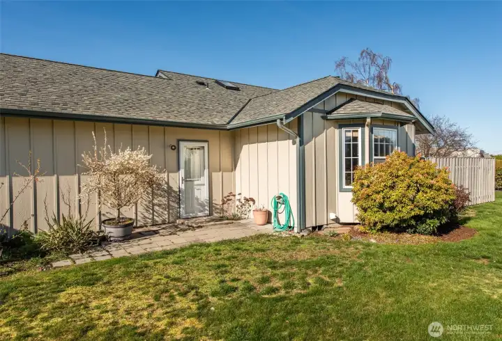 Door from garage to green space
