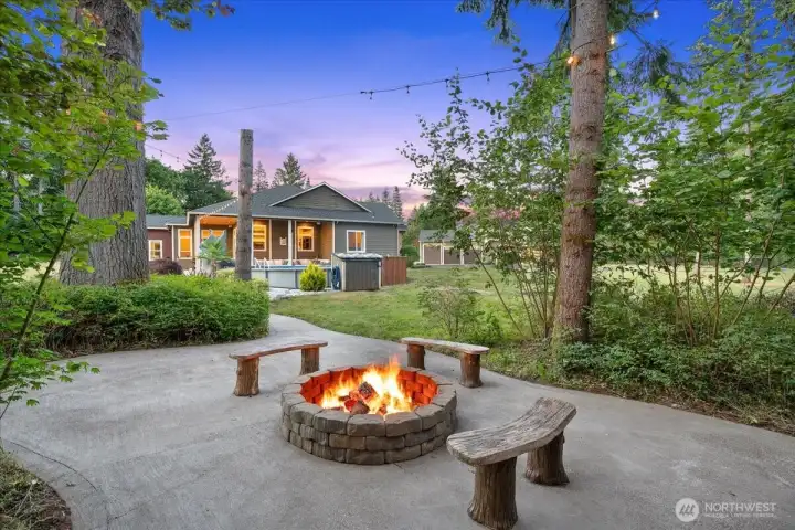 Outdoor firepit with wood storage