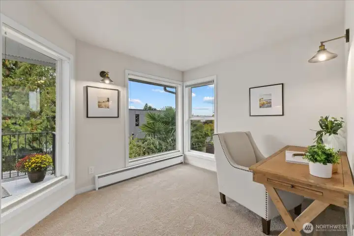 This sitting area is large enough for a desk. Perfect for daily journaling or planning out your day's adventures.