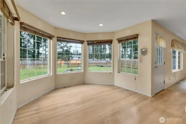 Sunny breakfast nook surrounded by windows