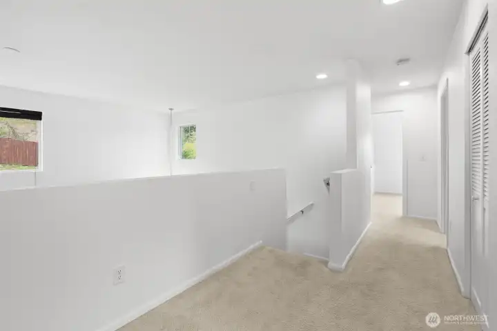 Hall and loft open to downstairs living space