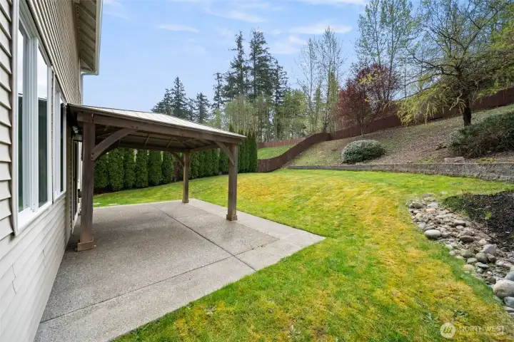 Concrete patio and gazebo perfect for outdoor cooking and dining