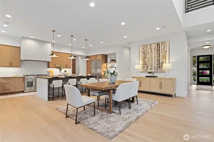 Seamless open-concept living with spacious informal dining, entertainer’s island and clean modern finishes.