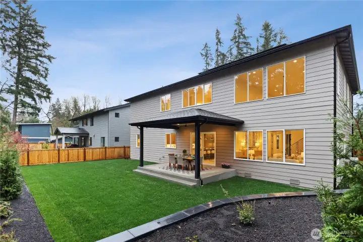 Level, fully fenced yard with covered outdoor living, ideal for year-round dining and entertaining.