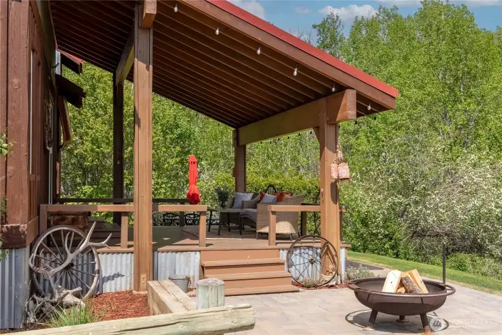 Relax, laugh, and gather around the fire—this is outdoor living at its best. Enjoy iced tea on the covered deck, fire up the BBQ, and unwind surrounded by cool, lush greenery in a peaceful, private setting.