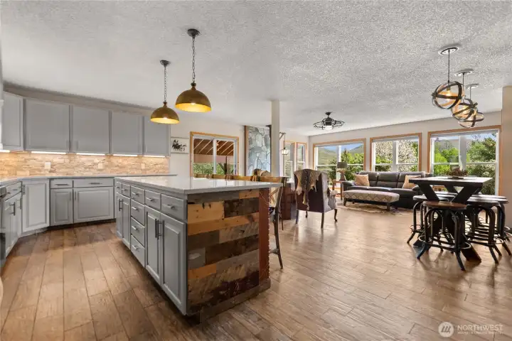 Expansive open-concept layout showcases the kitchen, dining, and living areas in one cohesive space.