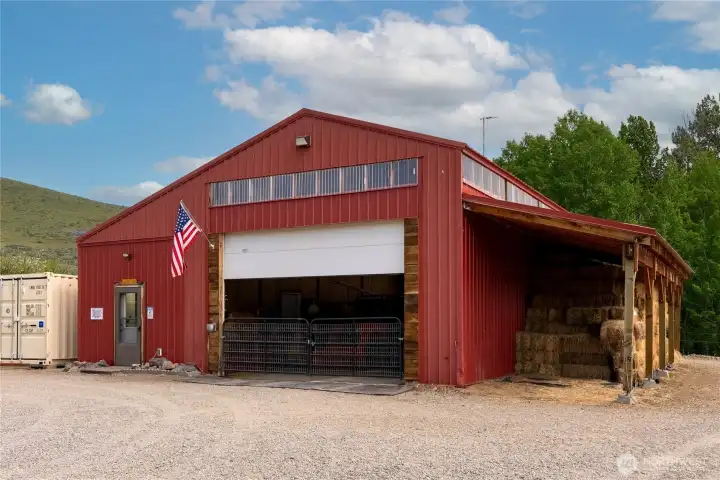 Spacious insulated shop (12' x 40") shop features oversized door, and ample workspace/storage—ideal for oversized equipment & vehicles, work space and storage for year-round projects.