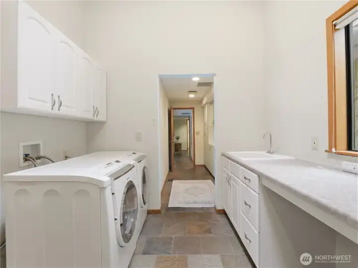 Large utility/laundry room with additional storage