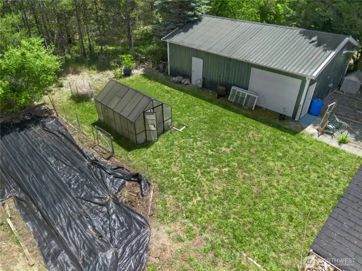 Aerial with with shop, garden space, grass, fully fenced. Dog friendly.
