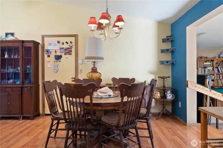 Dining room with eat-in kitchen. Garage door is to the left.