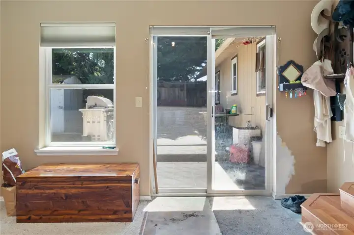 Slider to the back deck and fully fenced backyard.