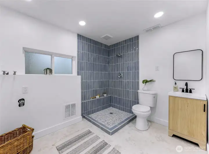 3/4 bath downstairs with laundry hookups (towel bars were added after photo taken)