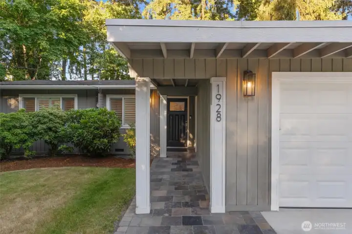 Classic Enatai residence surrounded by mature landscaping and timeless curb appeal.