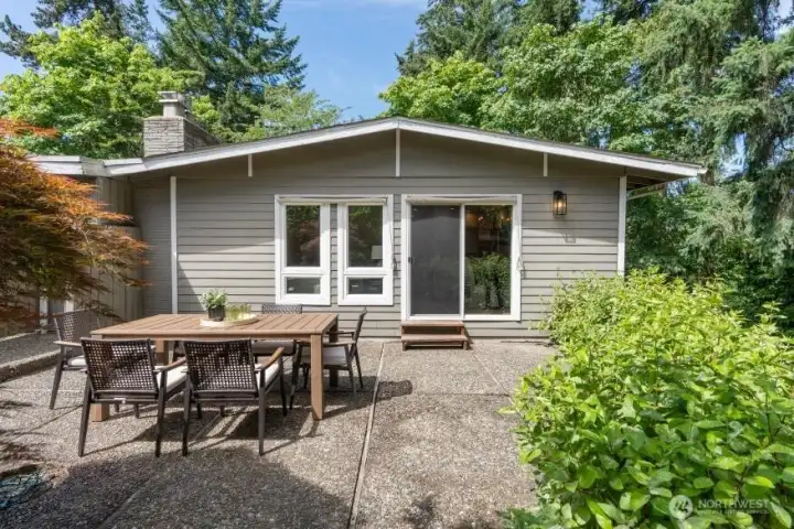 Private patio off the dining room overlooking a beautifully landscaped backyard, perfect for outdoor entertaining and everyday enjoyment.