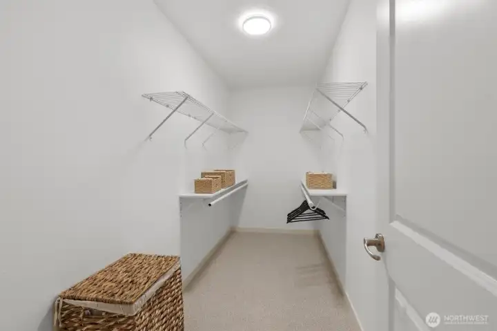 Generous walk-in closet offering abundant hanging space and everyday organization.