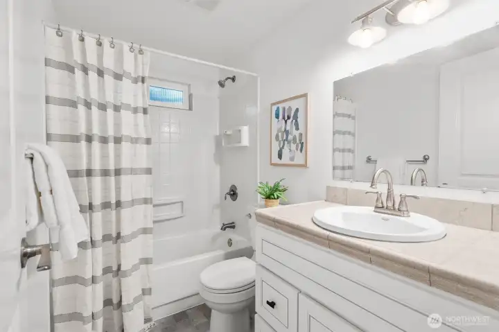 Updated bath with clean lines and timeless finishes.