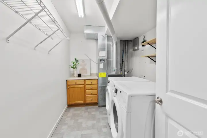 Functional laundry area with additional storage space.