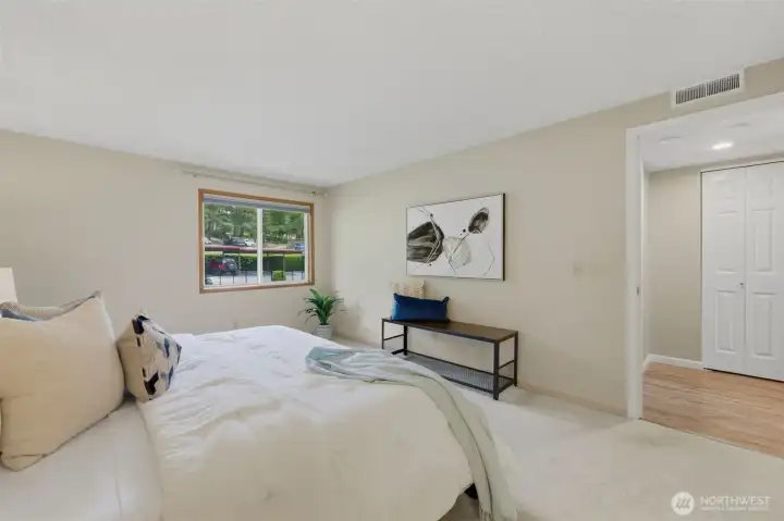 Just outside the primary bedroom door, a convenient hall closet serves as a great space for linens and household supplies.